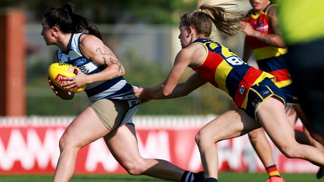 Julia Crockett-Grills is tackled by Teah Charlton. Picture: James Elsby/AFL Photos via Getty Images