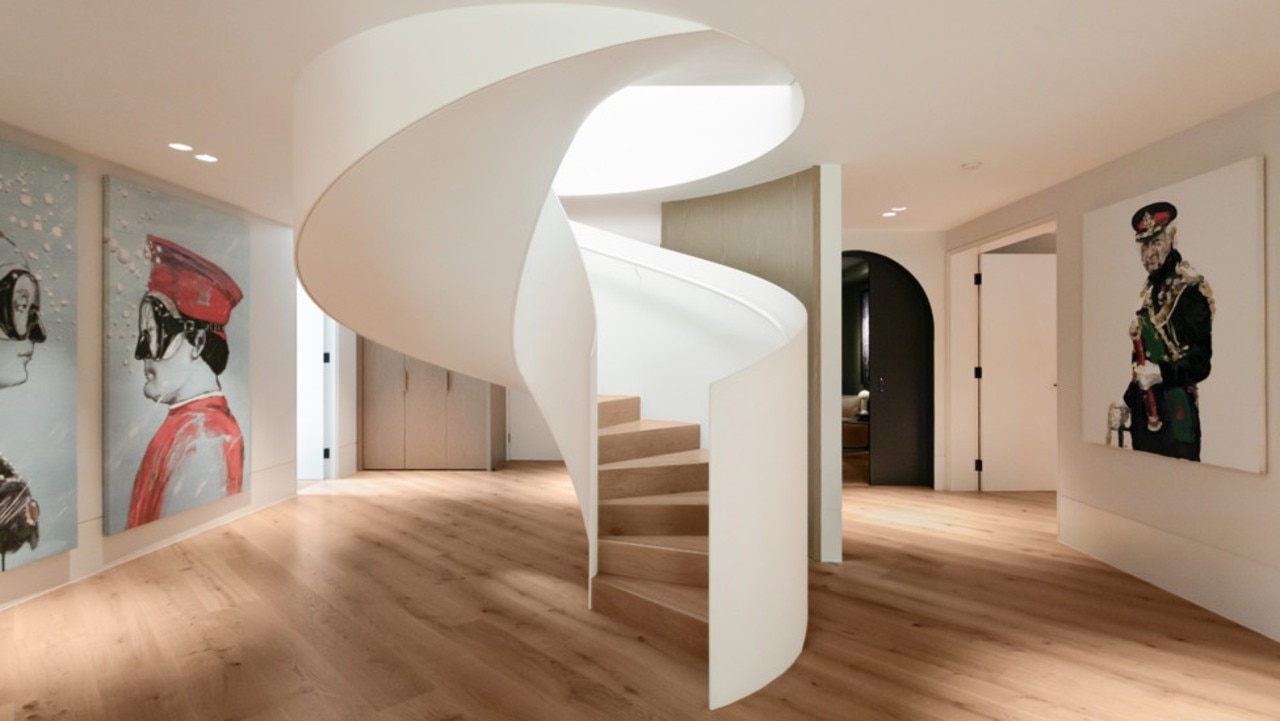 The interior design of the home resembles a gallery, with a steel spiral staircase the centrepiece.