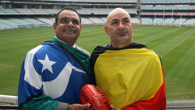 Egan (right) with former Essendon champion Michael Long.