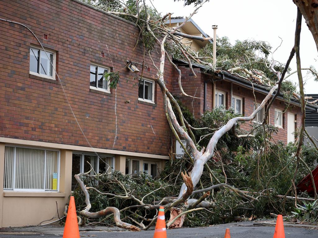 Storm damage is seen at St Johns Anglican Church, in Gordon, north of Sydney, Tuesday, November 26, 2019. A severe fast moving thunderstorm has passed over Sydney resulting in fallen trees and downed power lines in several Sydney suburbs. (AAP Image/Dan Himbrechts)