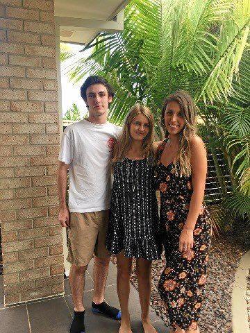 MOURNING: Jake Moore, 21, left, died after a tragic incident on a hinterland road and was found by motorists early Wednesday morning. He's pictured here with his sisters, Stephanie, right, and Rachel, centre. Picture: Contributed