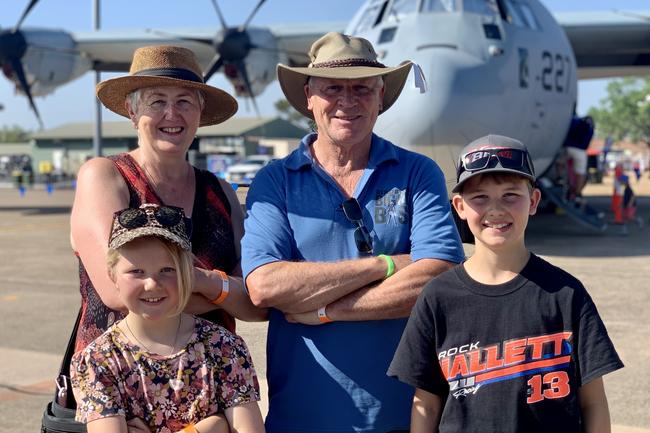 Channelling their inner Top Guns are grandparents Kae Densley and Greg Densley with Joni White, 8, and Tanner White, 10, from Victoria for the Chariots of Fire event at Hidden Valley but stopping by the Pitch Black Open Day at RAAF Darwin. Saturday, August 27, 2022. Picture: Tara Miko