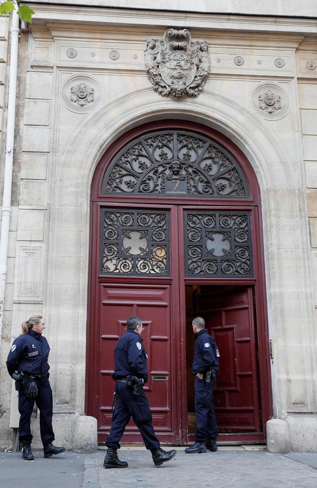 Police officers standing guard at the entrance to Hotel de Pourtalès where Kardashian was robbed at gunpoint.