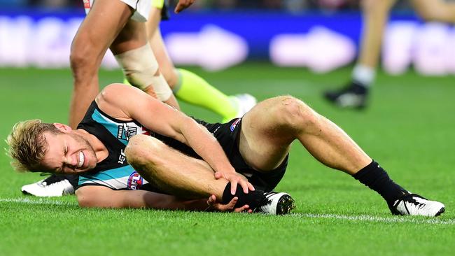 Jack Watts grabs his broken ankle after a clash with Dale Thomas in Round 2. Picture: Mark Brake/Getty Images