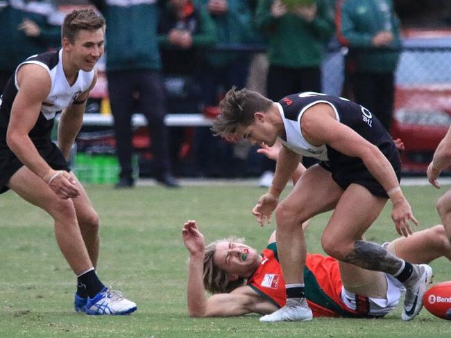 The Basin footballer Mitchell Rule just seconds after the bump. Picture: Davis Harrigan