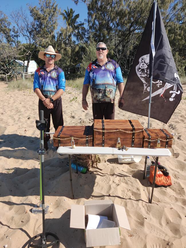 TREASURE HUNT: Port Curtis Metal Detecting Social Club founders Andrew Austin and Tony Perham with the treasure chests full of prizes which people scoured the beach for keys to open. Picture: Rodney Stevens