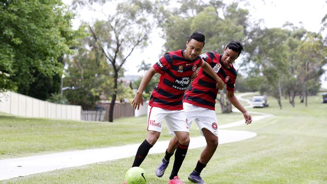 Kearyn Baccus 24 and his brother Keanu Baccus 17 face off in a friendly game in their local park.