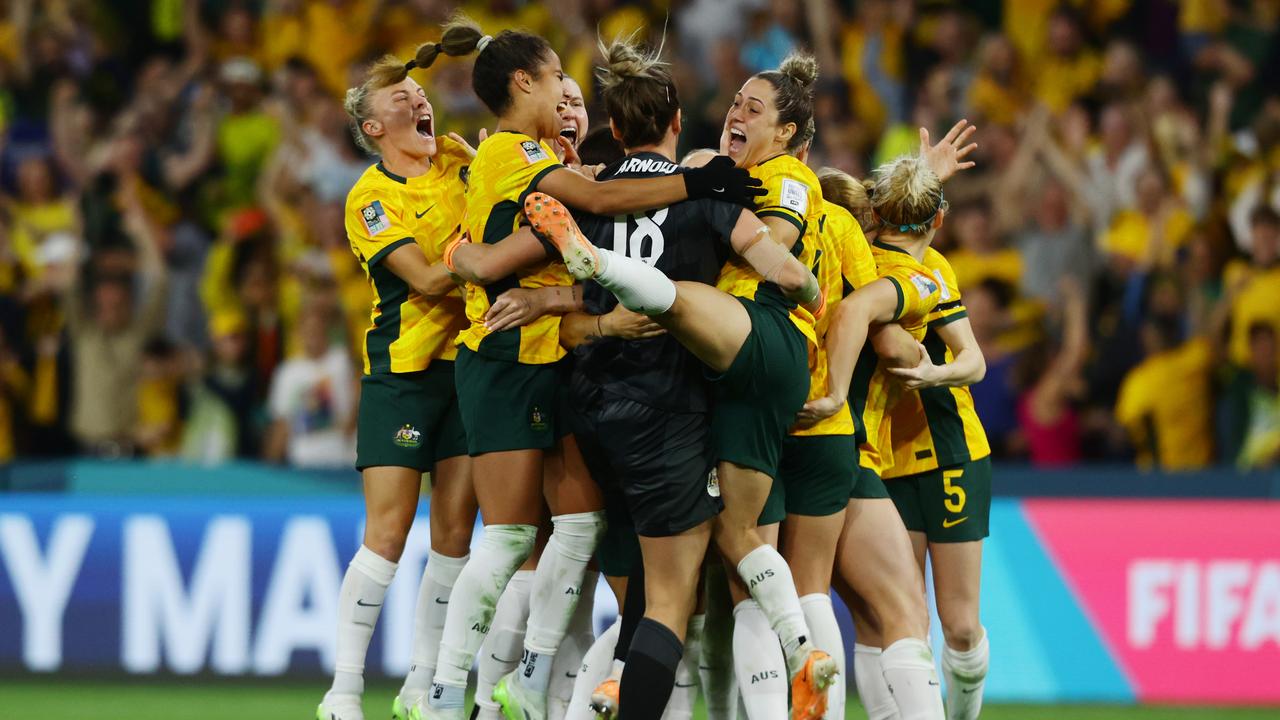 Matildas players celebrate winning the quarterfinal match against France at Brisbane Stadium. Picture Lachie Millard