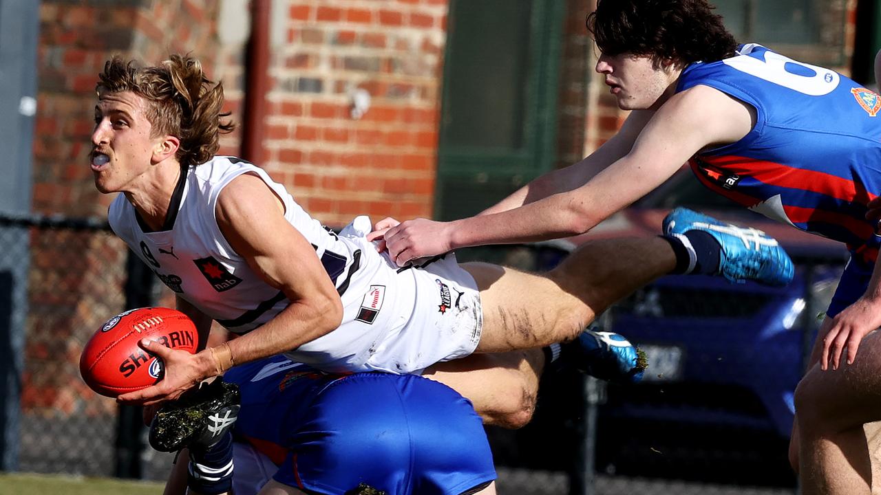 Northern Knights captain Joel Trudgeon leaps over an opponent to break clear against Oakleigh Chargers. Picture: Michael Klein