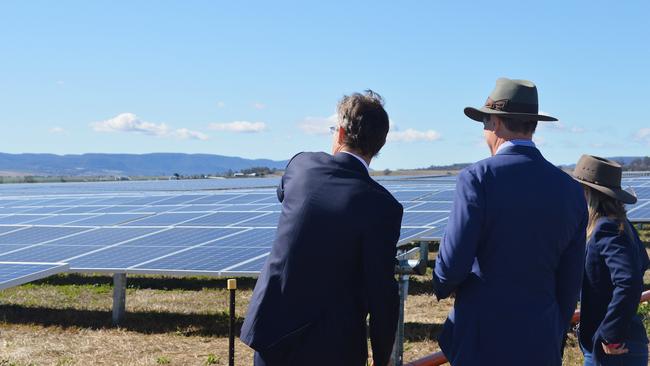 BRIGHT FUTURE: UQ Vice-Chancellor Peter Hoj AC stands with Queensland Minister for Natural Resources, Mines and Energy. Anthony Lynham and Minister for State Development, Tourism and Innovation Kate Jones overlook the Sladevale solar construction.