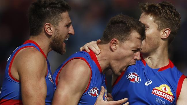 BALLARAT, AUSTRALIA - APRIL 10: Jack Macrae of the Bulldogs (C) celebrates a goal during the round four AFL match between the Western Bulldogs and the Brisbane Lions at Mars Stadium on April 10, 2021 in Ballarat, Australia. (Photo by Daniel Pockett/Getty Images)