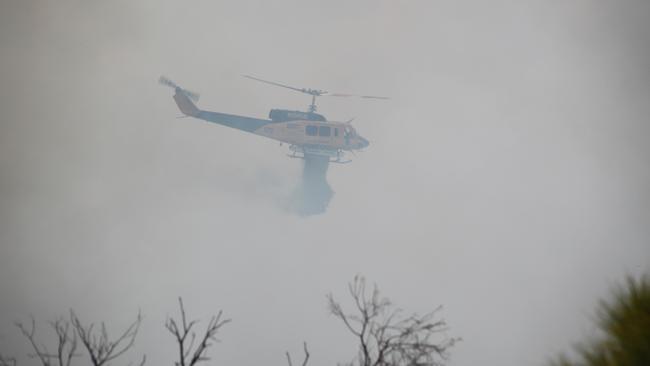 Water bombing aircraft, both helicopters and fixed wing, spent much of Thursday attacking the fire. Picture: NCA NewsWire / Anthony Anderson