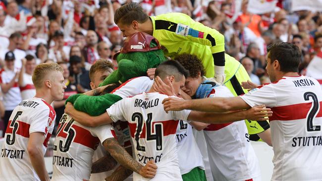 VfB Stuttgart's team players celebrate a goal.