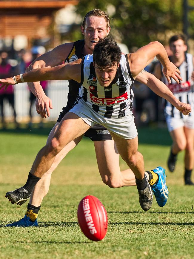 Brighton’s Shane Harvey chases PNU’s Cooper Young on Saturday. Picture: Matt Loxton