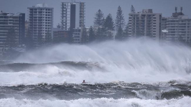 The outer fringe of Tropical Cyclone Alfred started to reach Coolangatta earlier Thursday. Picture: AFP