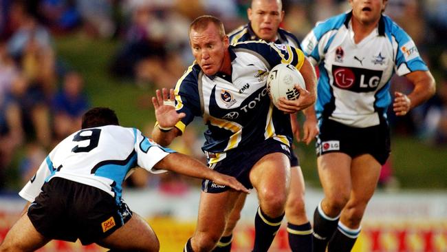 Kevin Campion rolls through the Sharks defence in 2003.