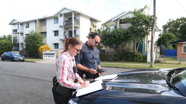 Task Force Guardian personnel detective senior constable Renee Pavicic and plain clothes senior constable Clarry Describes make an arrest plan while in the field in Cairns. Picture; Peter Carruthers