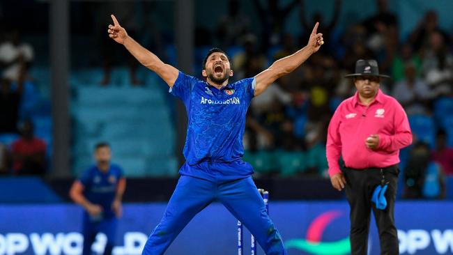 Afghanistan's Gulbadin Naib celebrates after the dismissal of Australia's Glenn Maxwell. (Photo by Randy Brooks / AFP)