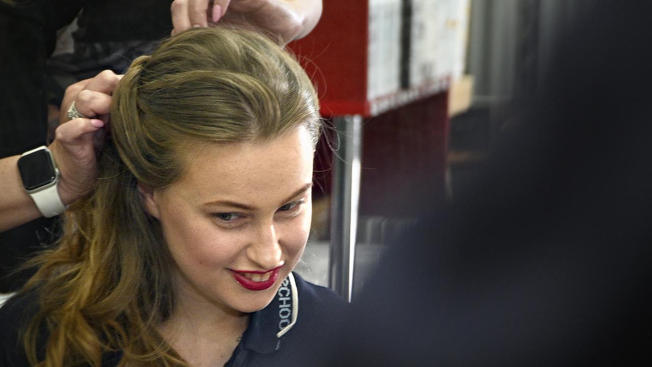 Students from Clifford Park Special School, who will have their senior formal tonight, have hair and make up done at Jazzy Lane. Anna-bellah Brown has the finishing touches put to her hair by Project School Formal founder Gay Hold.