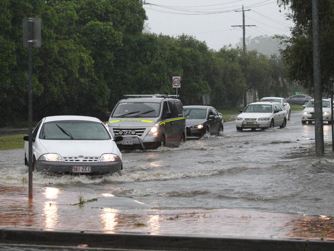 Cars during heavy down pores of rain on the Southern end of the Gold Coast. Pic Mike Batterham