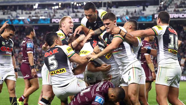 The Panthers celebrate after Bryce Cartwright of the Panthers scored a try.