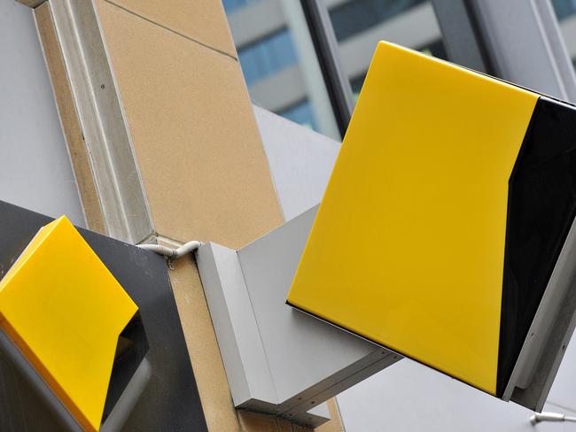 A file image of Commonwealth Bank of Australia (CBA) bank signage in Sydney, Friday, Oct. 23, 2015. CBA has agreed to pay $700 million to resolve proceedings brought by AUSTRAC after admitting to breaching anti-money laundering and counter-terrorism laws. (AAP Image/Joel Carrett) NO ARCHIVING