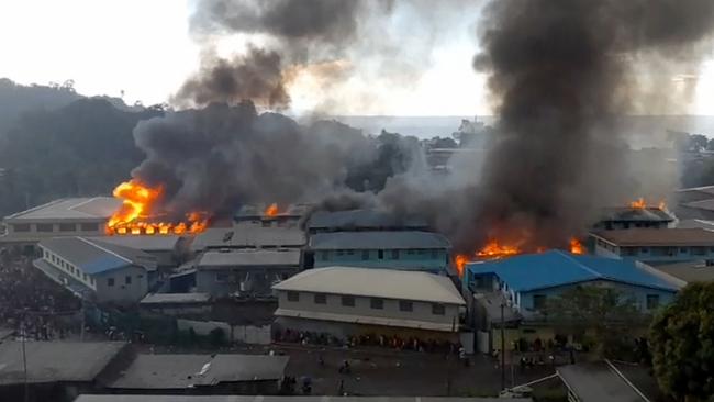 Fires in the Chinatown district in Honiara on Thursday. Picture: AFP