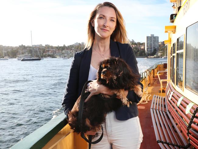 Stef McLaughlin and her dog Lukas, 2. Stef commutes by ferry to her work which is a dog friendly office and usually takes Lukas to work with her but now there’s a crackdown. Picture: Richard Dobson