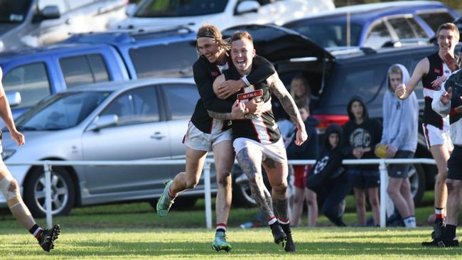 Millicent's Gene Robinson celebrates after kicking his 1000th career goal in the final minute of the Saints' Western Border Football League grand final win over South Gambier last season. The WBFL would be reduced to five teams without Casterton-Sandford. Picture: Thomas Miles