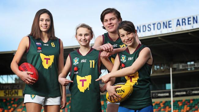 Tasmanian footballers, from left, Tahlia Bortignon, Bella Flack, Fraser Turner and Harry Flack help launch the search for the name of Tasmania’s representative football teams. Picture: LUKE BOWDEN