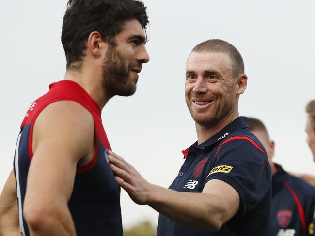 HOBART, AUSTRALIA - MAY 02: Simon Goodwin, Senior Coach of the Demons celebrates a win with Christian Petracca of the Demons during the 2021 AFL Round 07 match between the North Melbourne Kangaroos and the Melbourne Demons at Blundstone Arena on May 02, 2021 in Hobart, Australia. (Photo by Dylan Burns/AFL Photos via Getty Images)