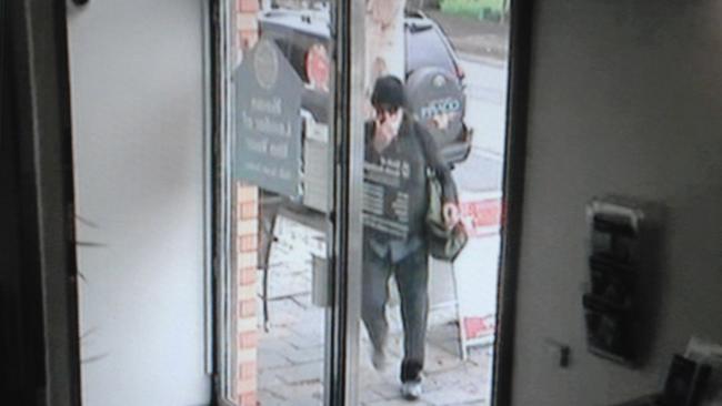 Surveillance video image of the Bicycle Bandit bank robber raiding the BankSA branch at Willunga.