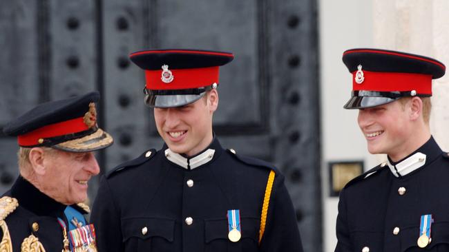 Prince Philip, with his grandsons, Prince William and Prince Harry. The princes will not stand next to each other as they walk behind their grandfather’s coffin. Picture: Getty Images