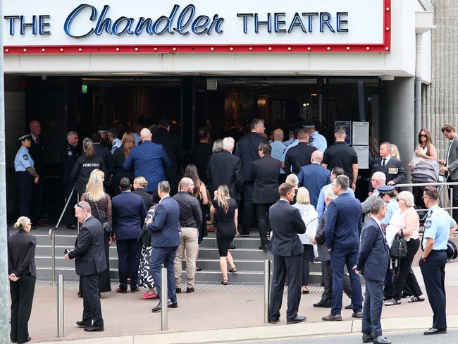 Family and friends joined hundreds of police members at the memorial for missing police officer Jay Notaro held at the Chandler Theatre in Brisbane.