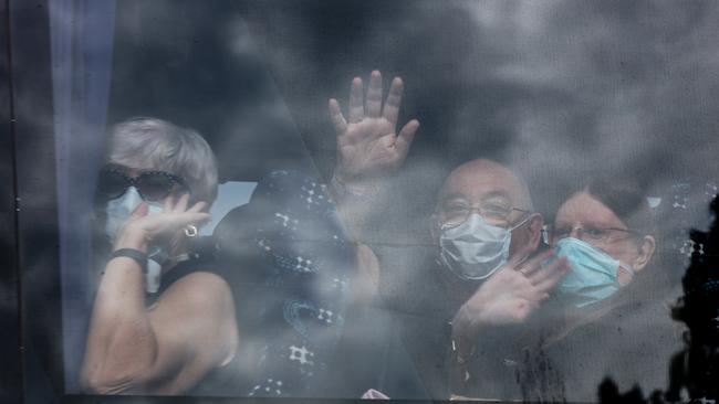 Passengers on a bus in Darwin after arriving on a Qantas flight from Yokohama. Picture: Glenn Campbell