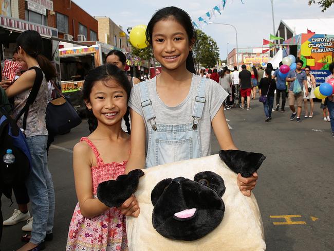 Elina 9-years with sister Jenibelle 11-years Vongphrachanh at the Moon Festival in 2017. Picture: Carmela Roche.