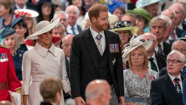 Prince Harry, Duke of Sussex and wife Meghan, Duchess of Sussex walk through Saint Paul's Cathedral in London for the National Service of Thanksgiving for The Queen's reign, their first public appearance in Britain in two years.