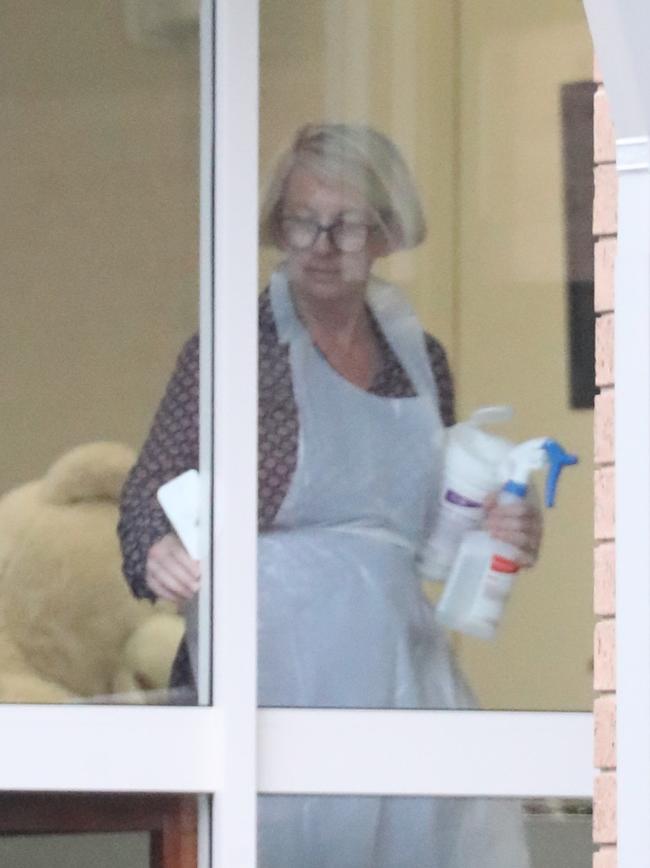 Staff inside the Dorothy Henderson Lodge at Macquarie Park where the COVID-19 virus has been found. Picture: John Grainger