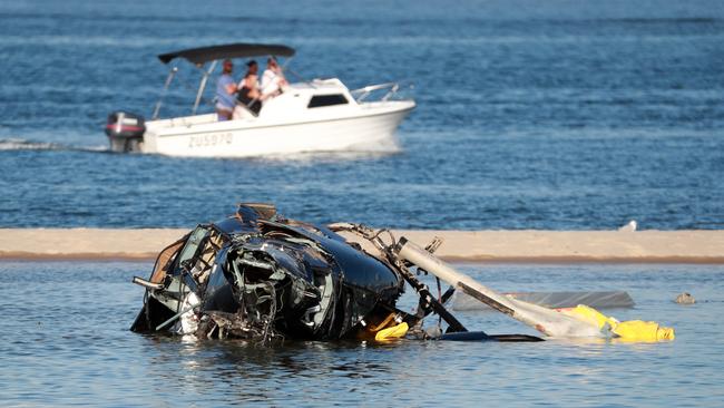 GOLD COAST, AUSTRALIA - NewsWire Photos JANUARY 3RD, 2023:  03 January 2023 - Gold Coast Helicopter Crash: Queensland Police and ATSB Officers recover the wreckage after four people were killed and many more injured after two helicopters collided near Sea World on the GoldCoast, 03 January 2023.Picture Scott Powick