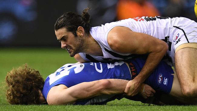 Brodie Grundy tackles Ben Brown. This tackle is set to give the Collingwood ruckman two weeks on the sidelines. (AAP Image/Julian Smith)