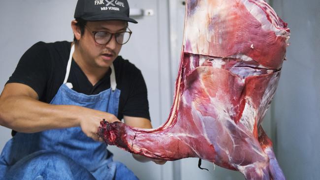 Jonas Widjaja of Fair Game Wild Venison breaking down wild caught deer in his commercial processing facility on his property in Goolmangar, northern NSW. Picture Elise Derwin