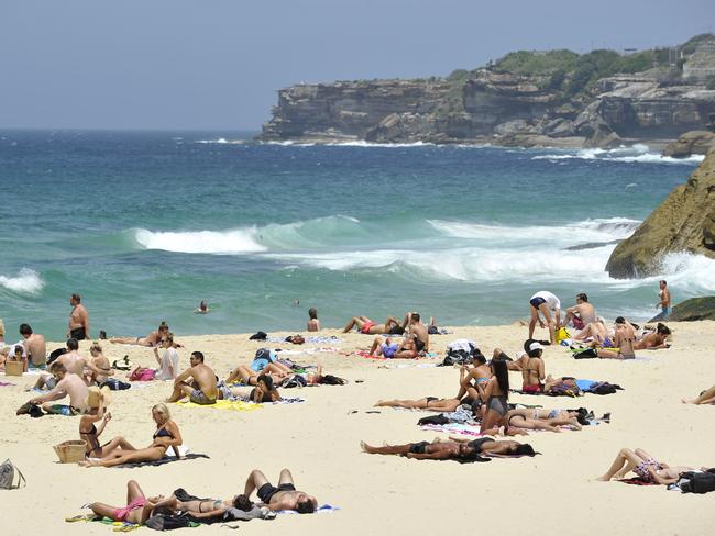 Beachgoers escape the heat at Tamarama Beach in Sydney. Picture: AAP/Joel Carrett