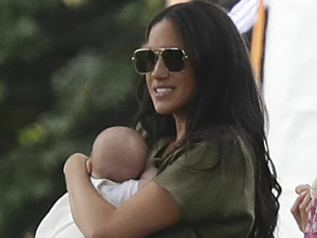 Britain's Meghan, Duchess of Sussex holding her son Archie, at the Royal Charity Polo Day at Billingbear Polo Club. Picture: Andrew Matthews/PA via AP.