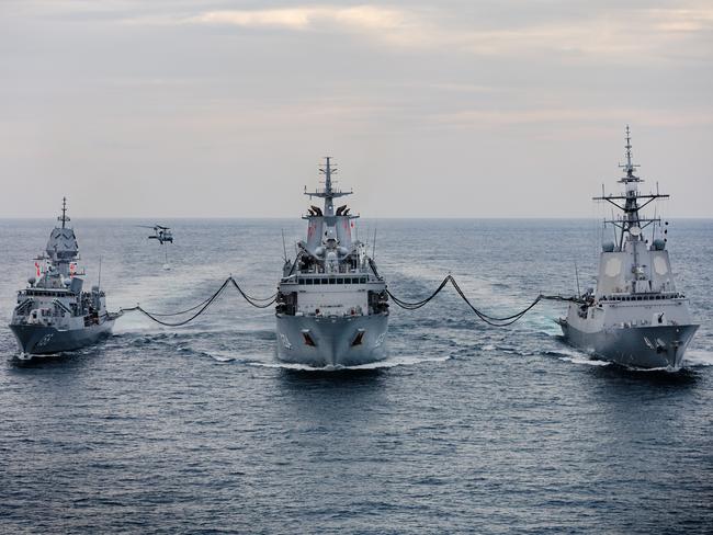 Replenishment vessel HMAS Stalwart (C) is currently out of action. Picture: Supplied/Royal Australian Navy