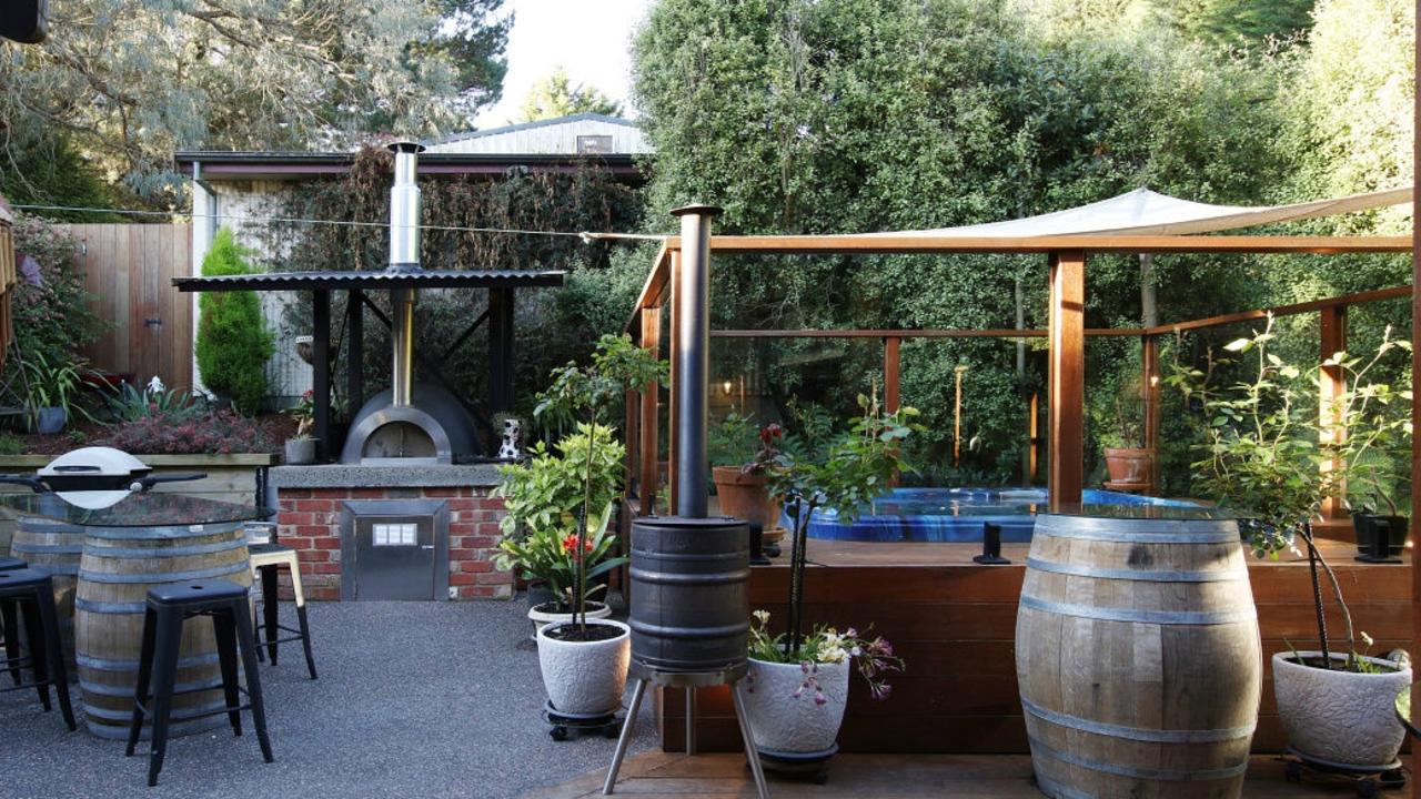 The outdoor entertaining area has a spa and pizza oven.