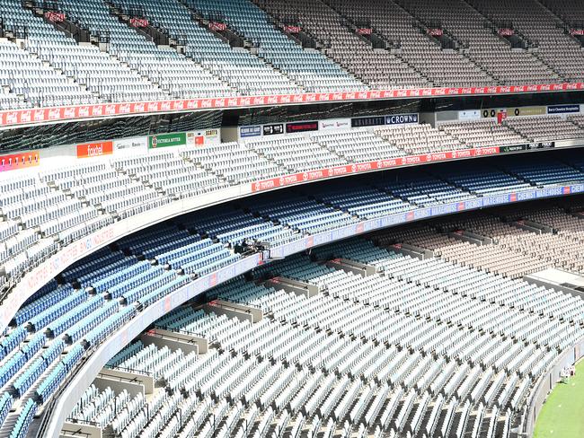 MELBOURNE, AUSTRALIA - MARCH 22: A general view of empty stands at trhe MCG during the round 1 AFL match between the Hawthorn Hawks and the Brisbane Lions at Melbourne Cricket Ground on March 22, 2020 in Melbourne, Australia. (Photo by Quinn Rooney/Getty Images)