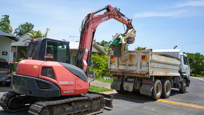 Clean up crews remove flood damaged items from Kamerunga Villas on Thursday. Picture: Nuno Avendano