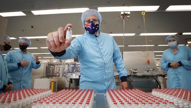 Here’s one they made earlier … Scott Morrison with a vial at CSL’s Parkville facility on Friday. Picture: Getty Images