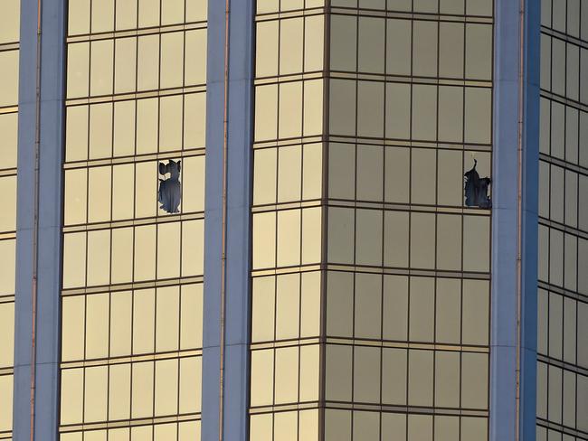 Broken windows are seen on the 32nd floor of the Mandalay Bay Resort in Las Vegas where a gunman opened fire on revellers at a country music festival. Picture: David Becker/Getty Images/AFP