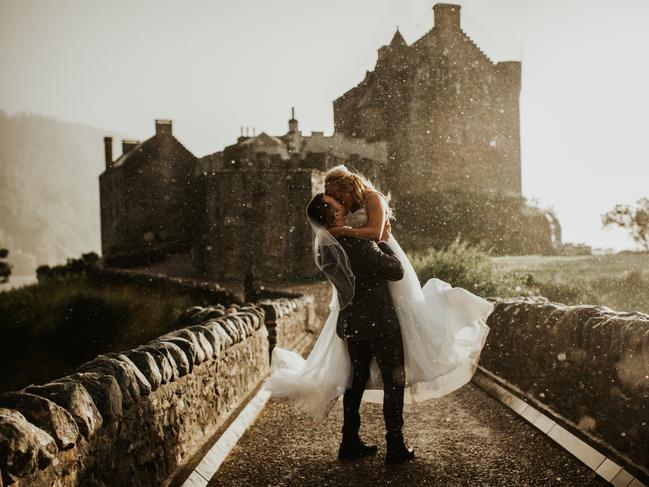 Colin Ross took this photograph of a couple outside Eilean Donan Castle in Scotland.